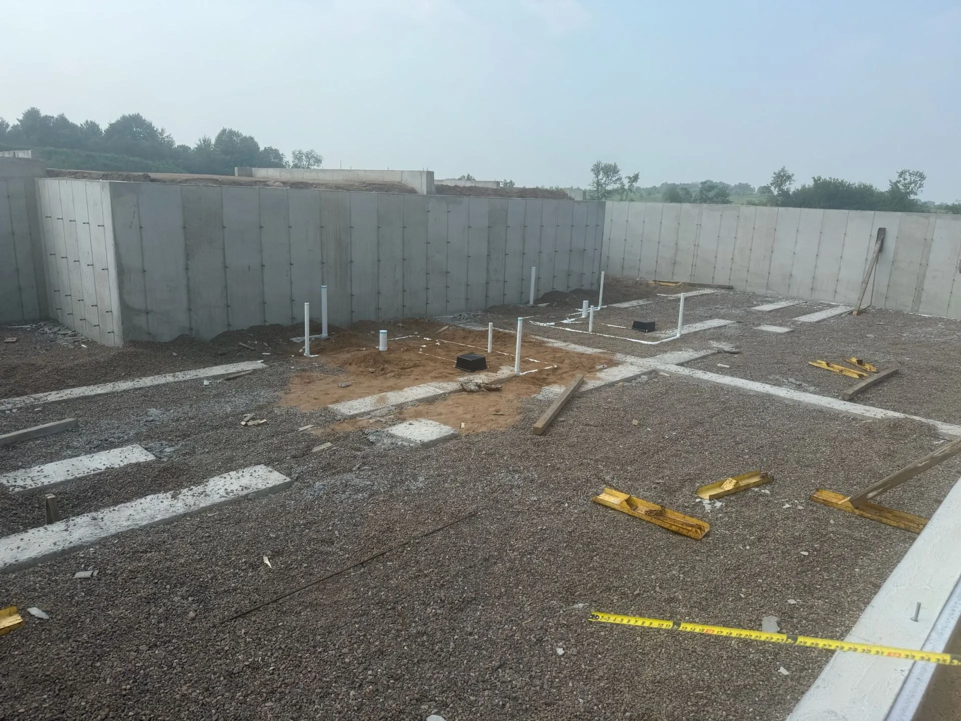 Poured concrete foundation walls with rough plumbing stub-ups