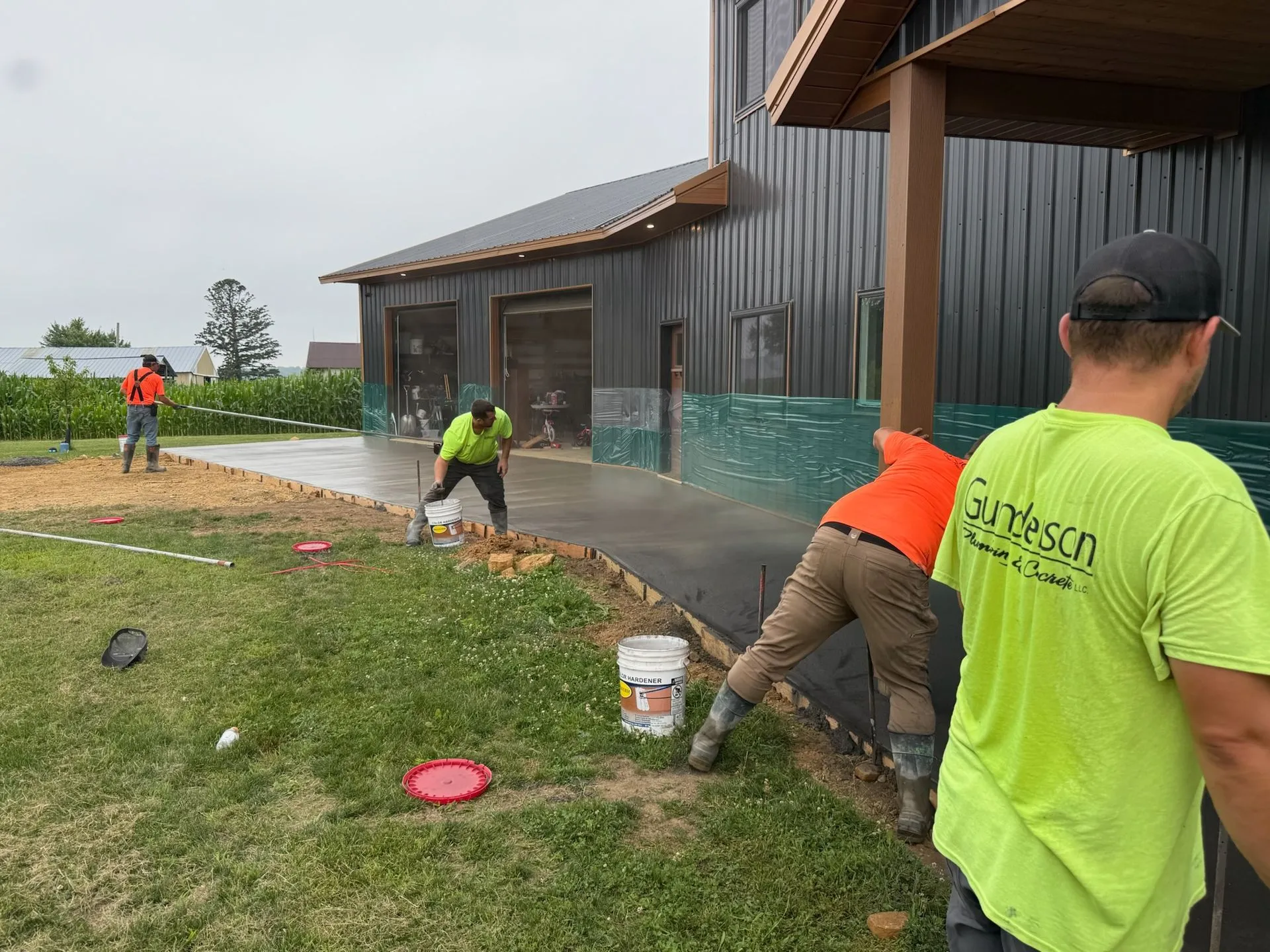 Crew placing colored concrete sidewalk